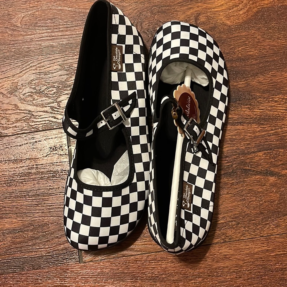 Hot chocolate checkered shoes.